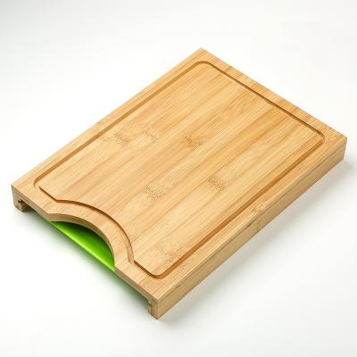 China Large Viable Bamboo Cutting Board with Plastic Tray Container and Juice Grooves Wooden Chopping Block with Slide Plastic Tray Drawer for sale