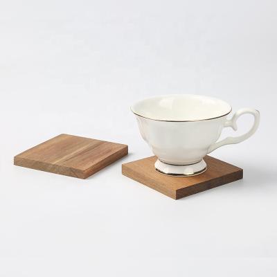 China 2021 Viable Stylish Set of 4 Wooden Juice Mat Tea Cup Mat Table Pads Natural Acacia Beer Coffee Tea Holders Set with Stand for sale