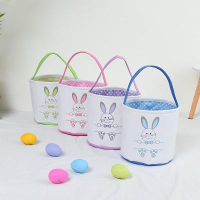 China Cute Hot Sale Decoration Egg Candy Basket Canvas Fabric Easter Basket Bag With Handle for sale