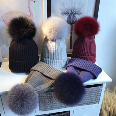 China Cozy Winter Knitted Removable Pom Pom Hat Unisex Fox Fur Beanie Hat Thick Women Bobble Hat for sale