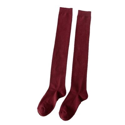 China New autumn and winter fashion light pressure solid color antibacterial stockings above the knee socks for sale