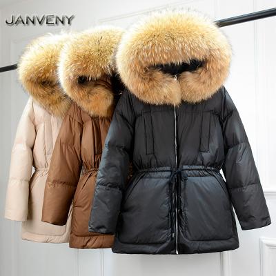 China JANVENY 2022 New Winter Big Fur Hooded Natural Feather Collar Fluffy Coat Women Warm Retractable Raincoat Waist Down Jacket for sale