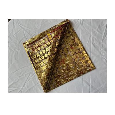 中国 Wholesale hot sale polyester fabric waterproof polyester soft fabric cheap polyester fabric bronzing process 販売のため