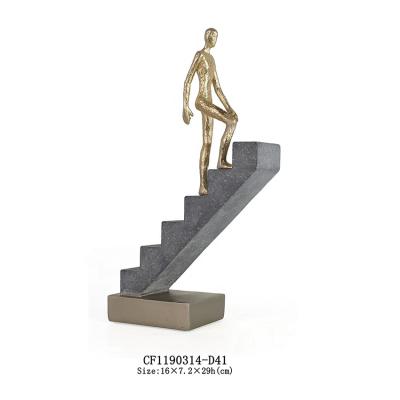 China Minimalist Modern Creative Character Climbs Small Stairs Resin Figurine Crafts For Living Room Decoration for sale