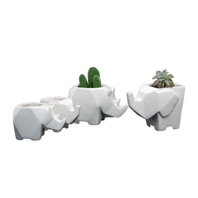 China Simply Modern White Ceramic Animal Pottery Mini Flower Rhinoceros Elephant Vase for sale