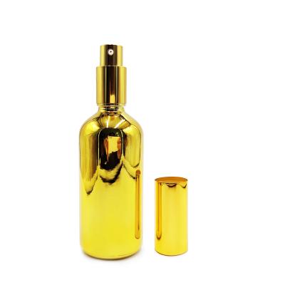 China Personal Care 100ml Gold Glass Bottle With Spray Cap For Perfume Bottle for sale