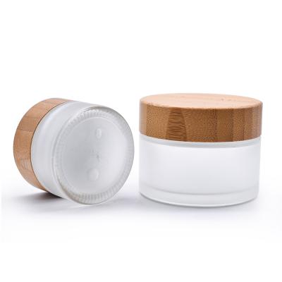 China Sustainable New Style Cosmetic Cream Jars Frosted Glass Jars Bamboo Glass Jars for sale