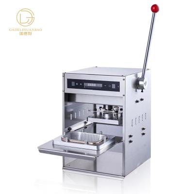 China Food packaging gold foil dinner box sealing machine stainless steel material is complete and convenient and fast aluminum gold fo for sale