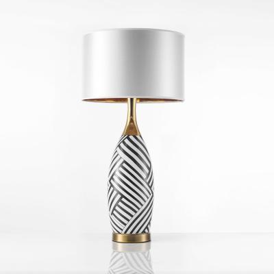 China Modern Modern Simple Style Bedside Ceramic Table Lamp with fabric wholesale living room villa Zebra stripes ceramic table lamp for sale