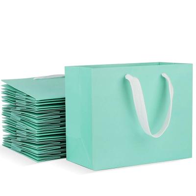 China Recyclable Plain Blue Packaging Paper Gift Bag With Customized Logo for sale