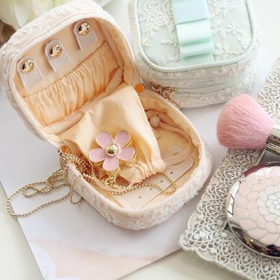 China Lace+Hot Selling Mini Embroidery Satin Flower Storage Eyelash Packaging Travel Jewelry Pouch Custom Lace Jewelry Bag Wholesale for sale