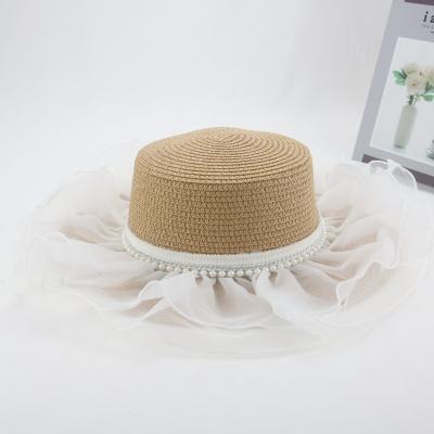 China Straw Hat Outdoor Travel Wide Brim Flat Beach Lady Pearl Flat Top Straw Hats For Women for sale