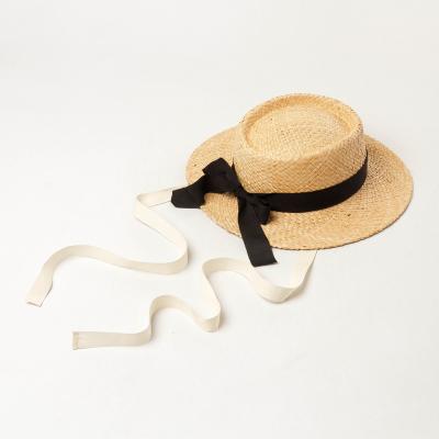 China 2022 Summer New Fashion Black Bowknot Handmade Natural Raffia Straw Hat Image for sale