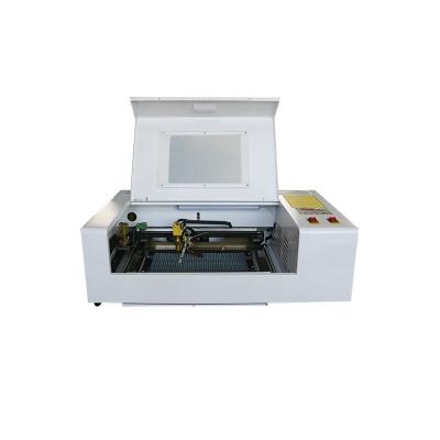 China Mini 3020 40w 50w CO2 CNC Laser Engraving Machine Acrylic Wood Glass Laser Air Cooled Leather Cutting Machine for sale