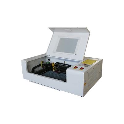 China MINI 40W50W 200mm*300mm CNC CO2 water cooled laser engraving cutting machine for wood rubber stamp for sale