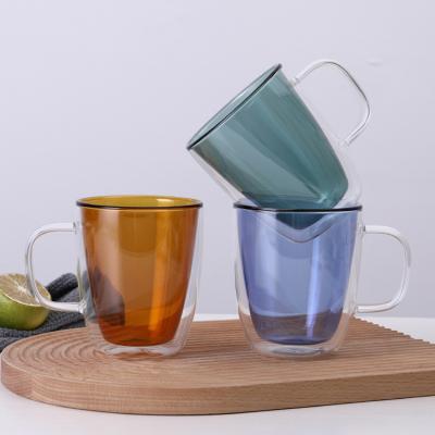 China Stored Heat Resistance 350ml Double Wall Colored Borosilicate Glass Tea Cup With Handle for sale