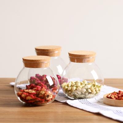 China Freshness Preservation Kitchen Transparent 500ml Borosilicate Spherical Glass Storage Jar With Cork for sale