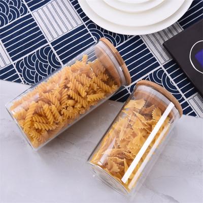 China Freshness preservation wholesales 800ml 1000ml 1400ml 1700ml high borosilicate glass storage jar with bamboo lid for sale