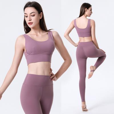 China Breathable High Stretch Yoga Two Piece Set U-Shape Back Wrap Bra And Stirrup Leggings Set Women's Sports Sets for sale