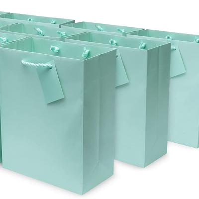 China Recycled Materials Custom Printing Paper Bags With Ribbon for sale