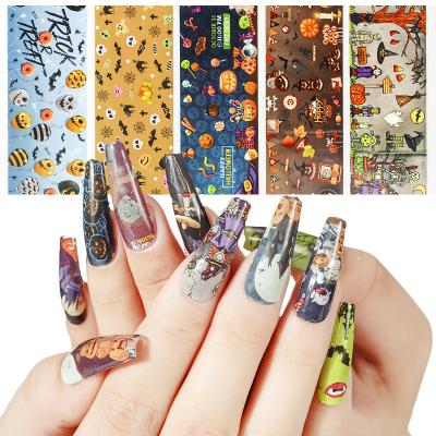 China DIY 10 Rolls Per Box Nail Foil Halloween Laser Snowman Snowflake Hat Tree Cartoon Series Christmas Transfer Foil Nail Art Sticker for sale