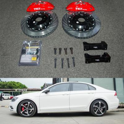 Cina Pinza da corsa a 4 pistoncini Kit freno grande VW 355 * 28 MM Disco da corsa ad alto tenore di carbonio e pastiglie freno per cerchio Lamando da 18 pollici in vendita