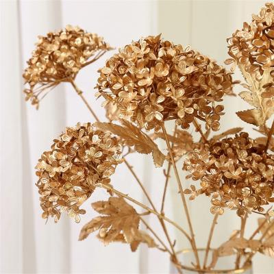 China Indoor Outdoor Decoration Gold Leaf Branch Sandalwood Leaf Hydrangea Gold Series Artificial Flower and Leaves for Home Wedding Decoration for sale