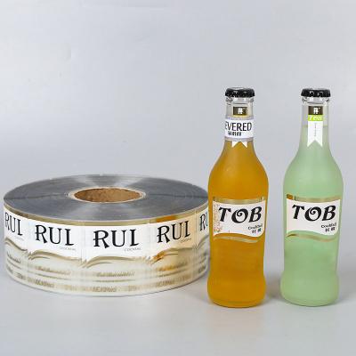 China Custom Printed Roll Self Adhesive Label For Bottle pet material label for sale