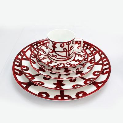 China Sustainable Modern Western Red Ceramic Plate Hotel Red Iron Art Porcelain Dish High Hard Dinnerware Sets for sale