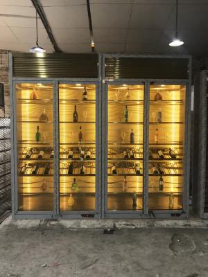 Cina La progettazione che raffredda l'esposizione d'acciaio tainless tormenta il grande gabinetto del vino dell'esposizione di vetro del whiskey della cantina della parete di lusso in vendita