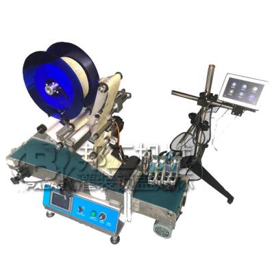 China High-speed multifunctional desktop automatic flat lid food labeling machine for sale