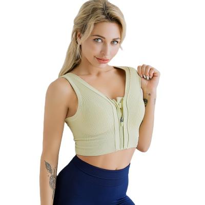 China New breathable women's buckle zipper explosion-proof tank top with removable pads sheer color yoga bra for sale