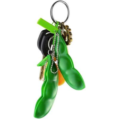 China Eco-friendly Squeeze Material Hot Toys Stir Bean Key Chain New Creative Extrusion Pea Bean Soybean for sale