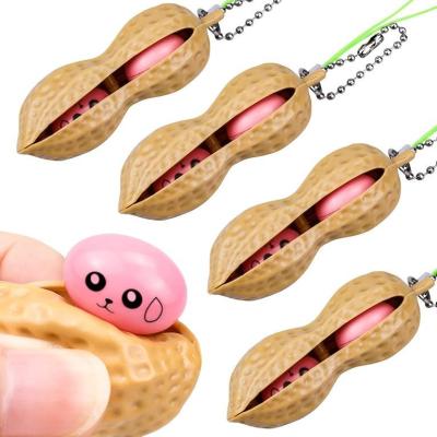 China 2023 Hot New Creative Eco-friendly Material Extrusion Peanut Toy Key Chain Squeeze Toys Bean Stir Key Chain for sale