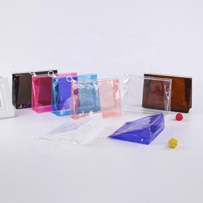 China Fashion Stock Fashion Makeup Bag Holographic Clear Transparent Toiletry Wash PVC Cosmetic Bag With Custom Logo 14 Colors In Stock. for sale