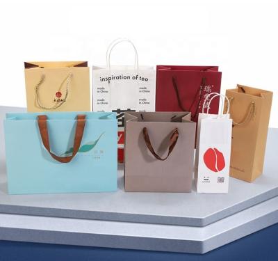 China Fashion Clothing Recyclable Custom Paper Bag Your Own Logo Printed Cosmetics Luxury Wine Gift Shopping Paper Bags With Ribbon Handles for sale