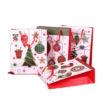 China Manufacturer Cheap White Christmas Recyclable High Quality Paper Gift Wrapping Paper Colorful Shopping Bags For Sale for sale