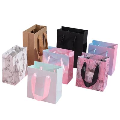 China Recyclable Gold Foil Hot Stamp Custom Shopping Paper With Logo Medium Shopping Paper Bags Gift Bags for sale