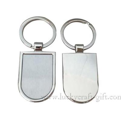 China Cheap Metal Stainless Steel Sticker Shape Oval Metal Mute Key Chain for sale