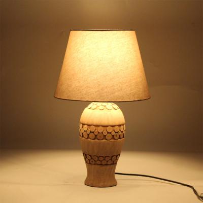 China New Design Modern Living Room Bedroom Carving Fabric Shade Decorative Ceramic Coffee Table Lamps for sale