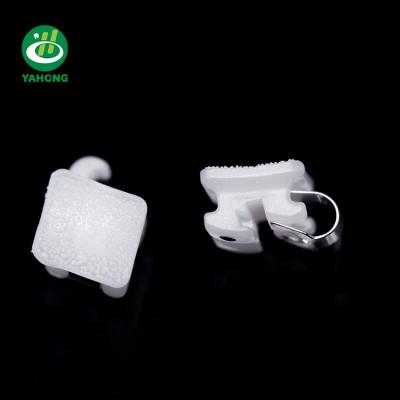 China Good Adhesive Ceramic Dental Braces Orthodontic Ceramic Self Ligating Bracket for sale