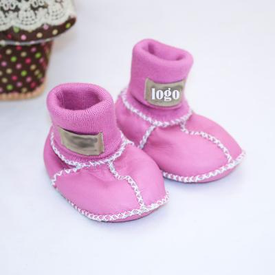 China Massage Baby Sneakers Moccasins Toddler Shoes Boys and Girls Soft Unique Leather Infant Pre Walker Shoes for sale