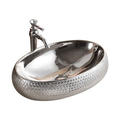 China Easy to clean unique design basin umywalka embraced ceramic silver texture counterp art basin bowl washbasin for sale