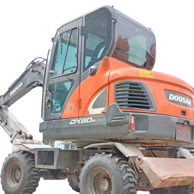 China Used Doosan DX60W excavator 6 tons small wheel excavator official wholesale purchase price is more affordable 0.18MÂ ³ for sale