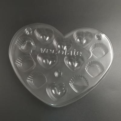 China Thermoformed Heart Shape 12 Holes Disposable Chocolate Packaging Macaron Blister Plastic Trays for sale