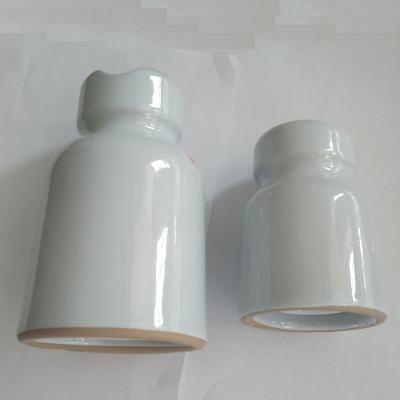 China Wire Holder RM-1 RM-2 Pin Insulator For Egypt Insulations Low Voltage Porcelain Wire Holder Low Voltage Ceramic Glazed Insulator for sale