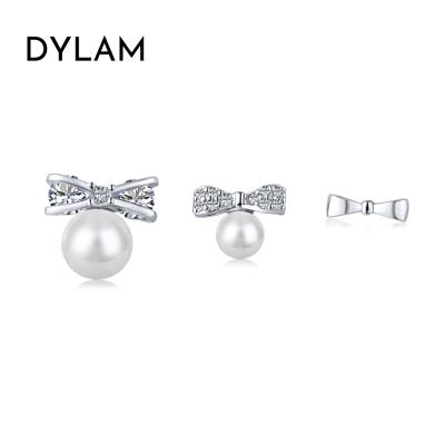 China INS FASHIONABLE Hot Selling Dylam Cute Tiny Imitation Pearl Bowknot Earring For Women CZ Temperament Cubic Stud Earrings Charm Jewelry for sale