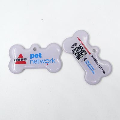 China 25x45MM Waterproof/Waterproof Dog Bone Form QR Code Printing NFC Epoxy Pet Tag With Hole And Rope for sale