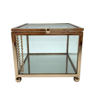 China Small Luxury Glass Jewelry Gift Square Cosmetic Storage Box With Metal Frame for sale