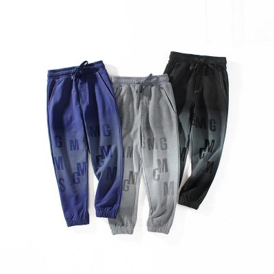 China Anti-pilling Factory direct sales custom fashionable all match lettersGradation gray kids slim casual pants for sale